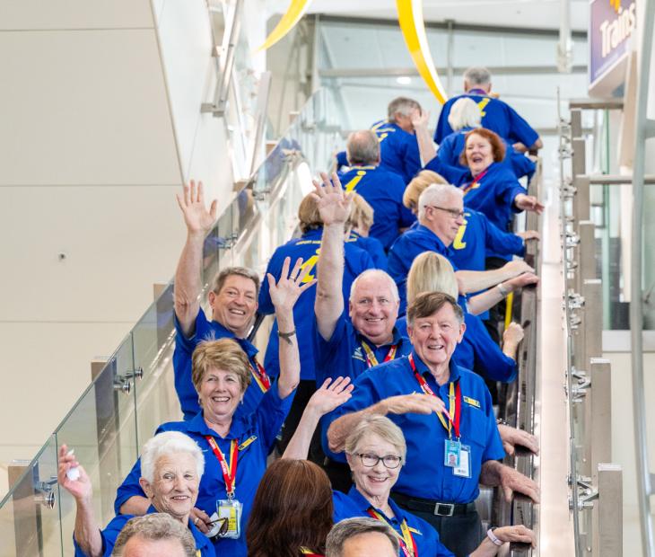 Airport ambassadors waving