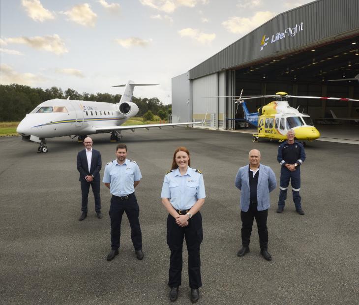 LifeFlight crew standing in front of aircrafts